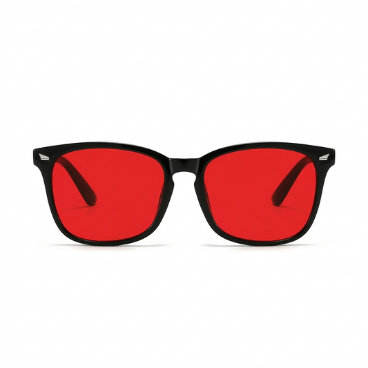 Glasses with red lenses and black frames on a white background